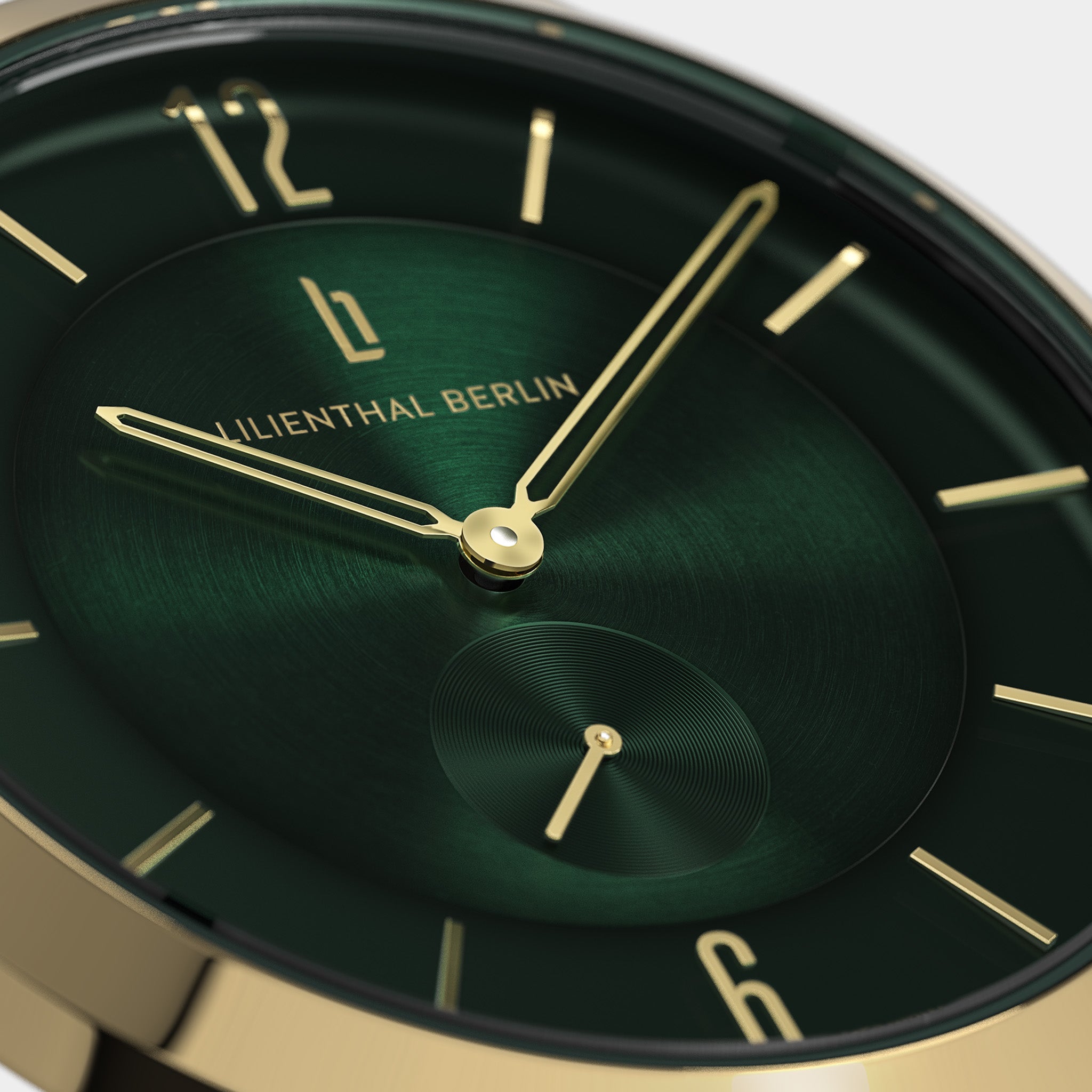 Close-up of luxury green watch face with gold hands and markers, minimalist design