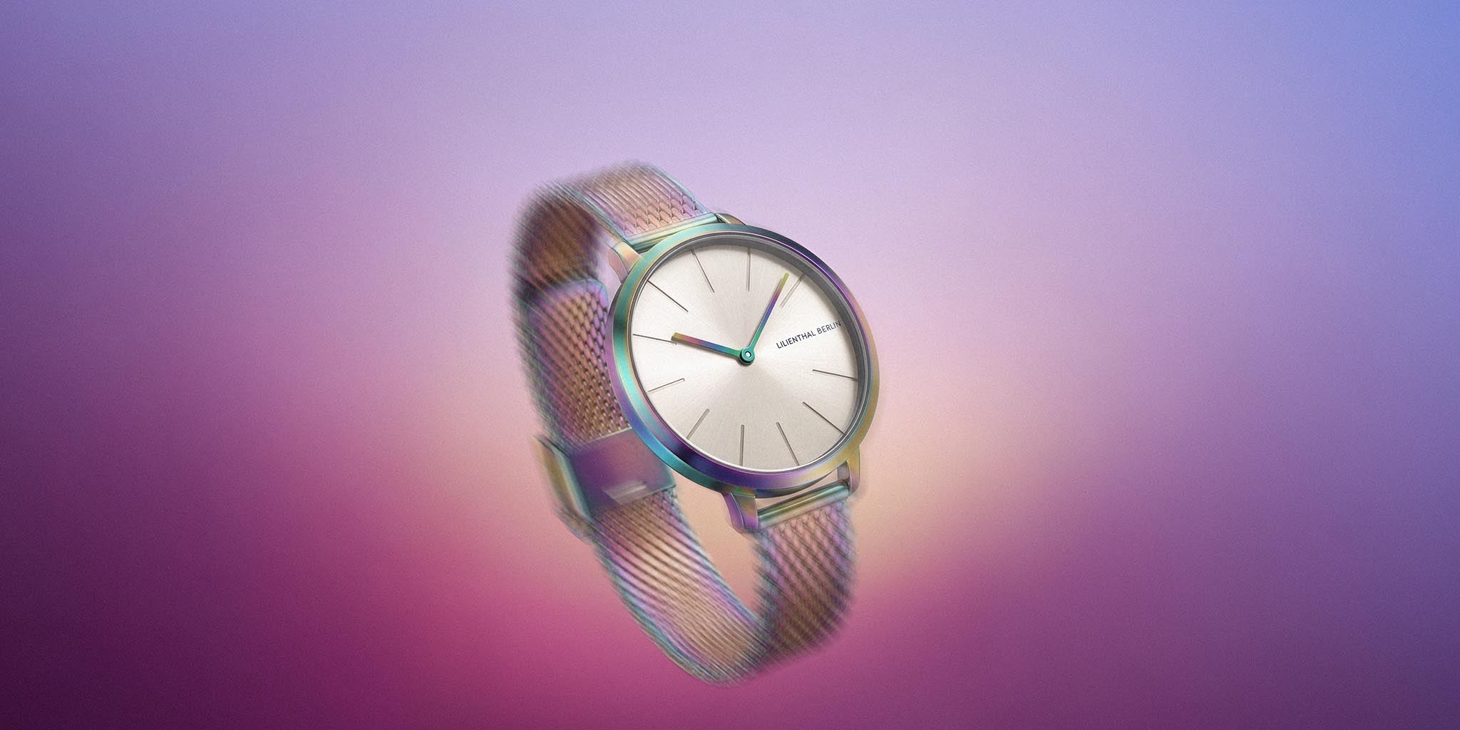 Minimalist silver mesh wristwatch with gradient background, modern and elegant design.