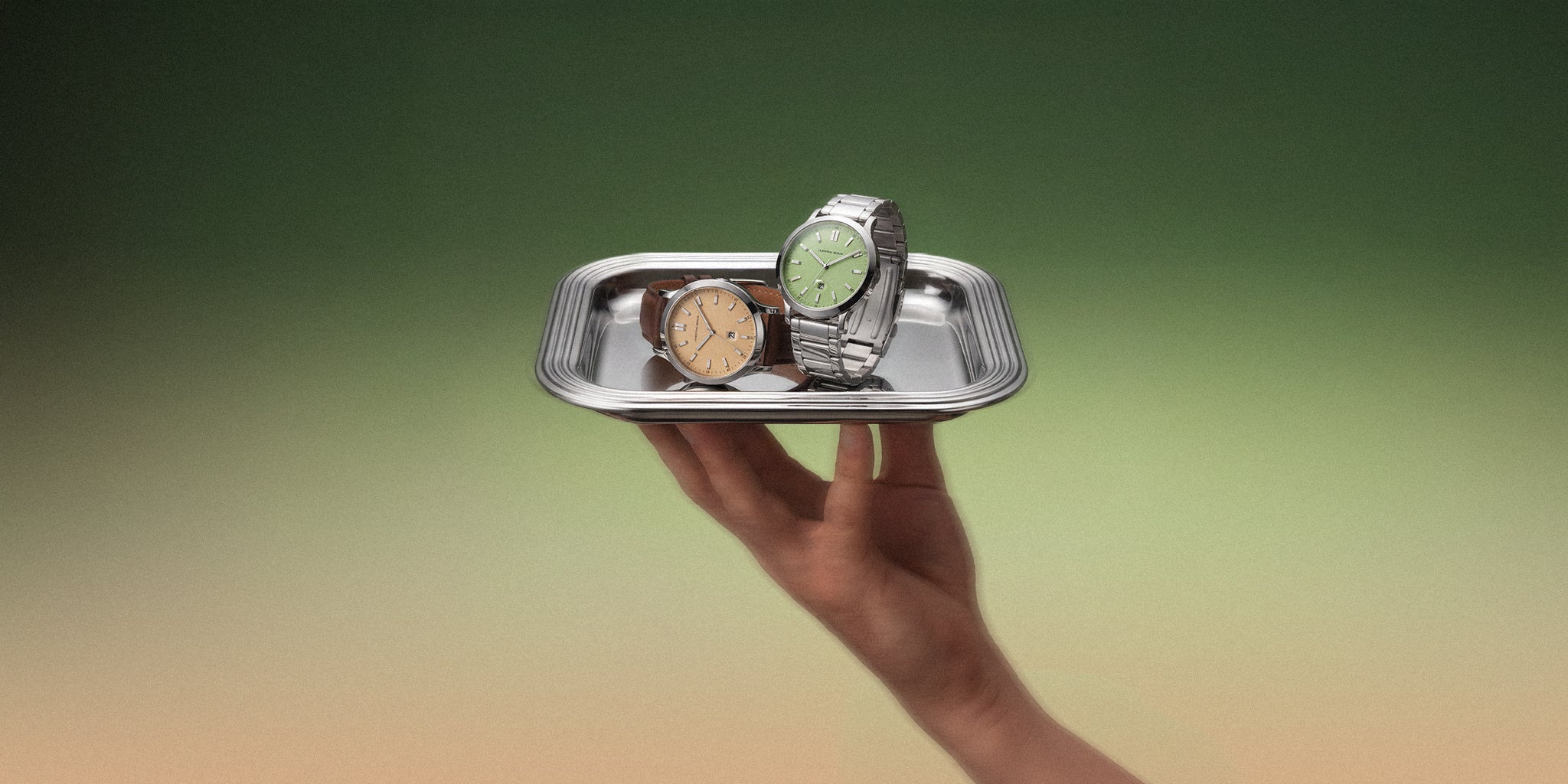Minimalist gold wristwatch with mesh strap and sleek dial on a neutral background