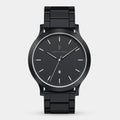 Sleek black analog wristwatch with metal band, minimalist dial, date display at 6 o'clock.