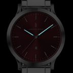 Minimalist men's watch with burgundy dial, luminous hands and metal link strap